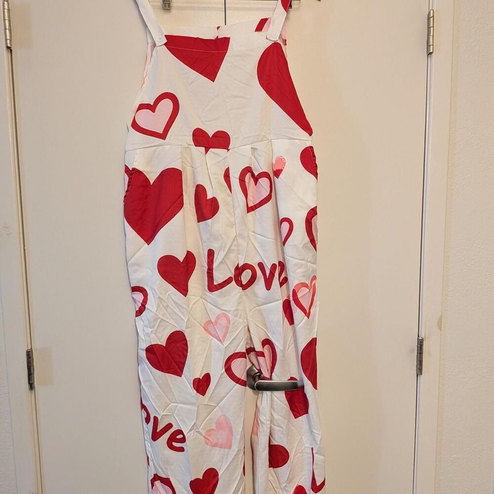 White & red heart print overalls with the word 'Love'